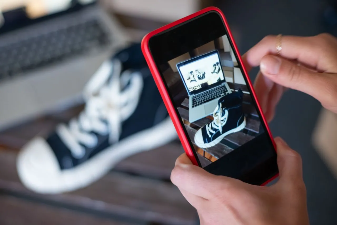 Capturing sneakers with a mobile phone for an online store showcase. E-commerce at its best.