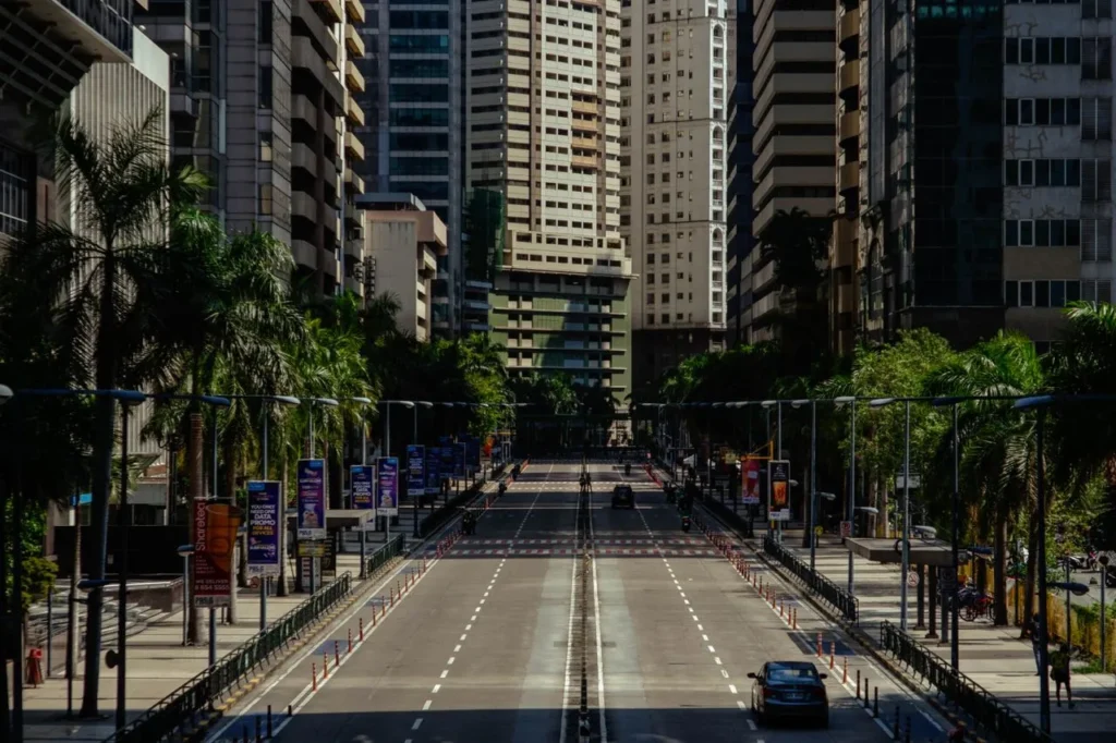 A serene street view in Pasig City, showcasing modern architecture and urban greenery.